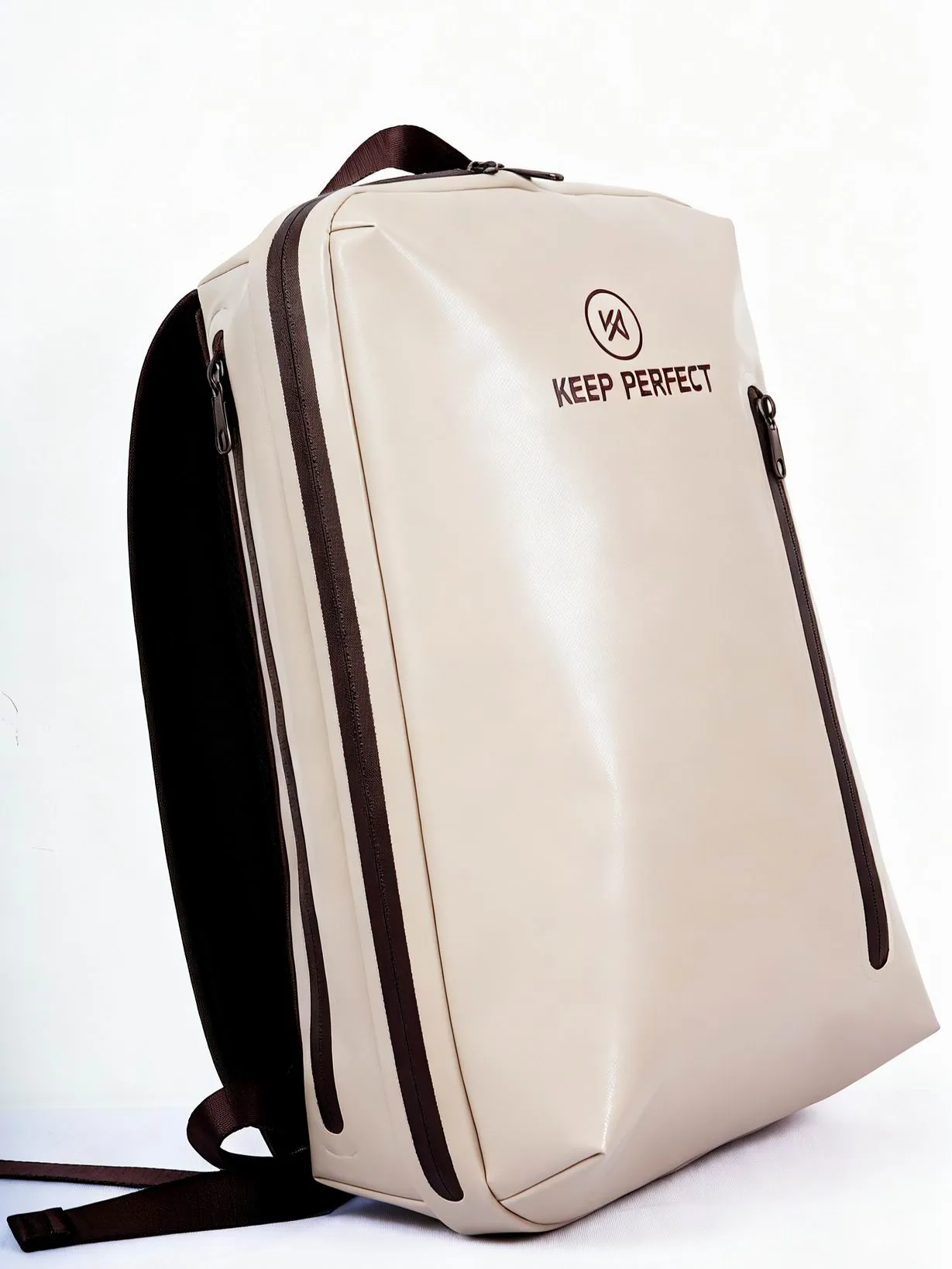 Detail shot of a waterproof commuter backpack showing zip garage, hardware finish, webbing attachment and KEEP PERFECT logo placement — these four details carry most of the perceived brand value